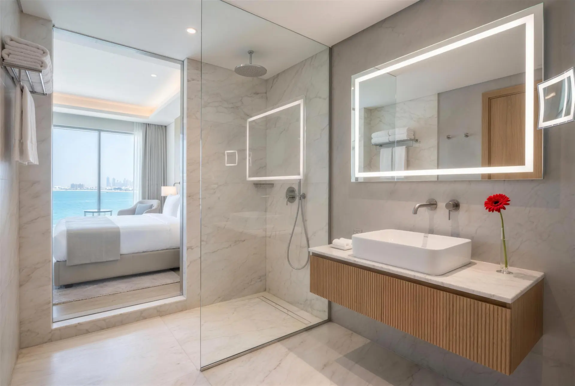 Marble bathroom with sea view through glass